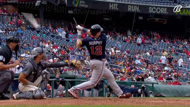 Sean Murphy follows through on his swing after breaking his bat
